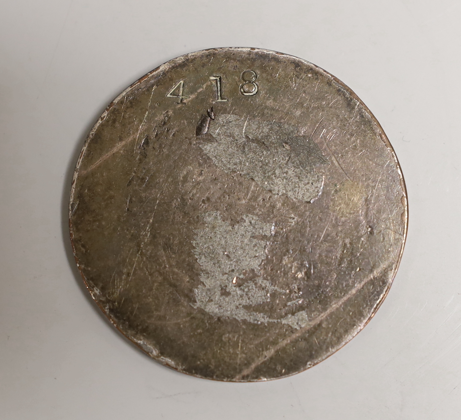 A circular silver seal-matrix of Sir Walter Raleigh, recast and subscriber issued by Crichton’s, c.1900, stamped no. 418 of an edition of 600, 55mm